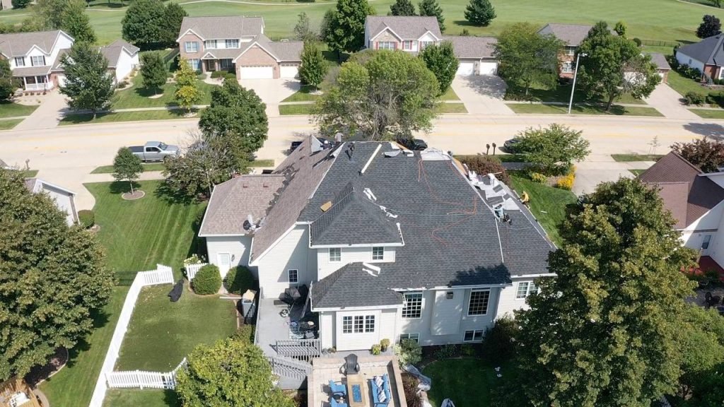 Aerial view of a residential roof replacement in progress near Peoria, IL